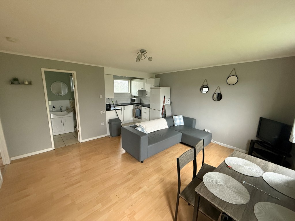 Lot: 6 - TWO-BEDROOM CHALET - Open plan kitchen and living room
